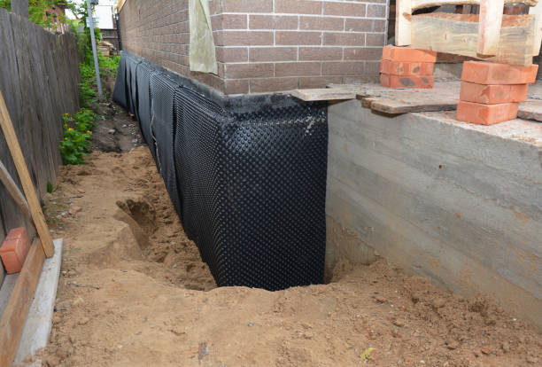 Happy homeowners after waterproofing job in Glen Head